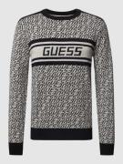 Guess Strickpullover mit Allover-Label-Muster Modell 'PALMER' in Black...