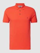 Tommy Hilfiger Slim Fit Poloshirt Modell '1985' in Neon Rot, Größe L