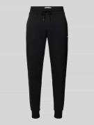 Tommy Jeans Slim Fit Sweatpants in Melange-Optik in Black, Größe M