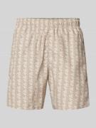 Lacoste Regular Fit Shorts mit Allover-Label-Muster in Beige, Größe S