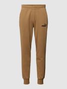 PUMA PERFORMANCE Sweatpants mit Label-Print in Camel, Größe XXL