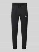 ADIDAS SPORTSWEAR Sweatpants mit elastischem Bund in Black, Größe L