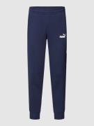 PUMA PERFORMANCE Sweatpants mit Label-Print in Dunkelblau, Größe S