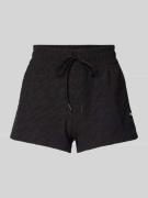 PUMA PERFORMANCE Shorts mit Logo-Muster in Black, Größe L