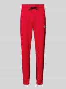 The North Face Sweatpants mit Label-Print in Rot, Größe M