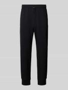 CHAMPION Sweatpants mit elastischem Bund und Tunnelzug in Black, Größe...