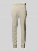 CHAMPION Sweatpants mit elastischem Bund in Beige, Größe L