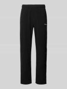 CHAMPION Sweatpants mit elastischem Bund in Black, Größe L