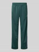 adidas Originals Sweatpants mit elastischem Bund in Dunkelgruen, Größe...