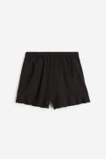 H&M Shorts mit Volants Schwarz in Größe 134/140. Farbe: Black