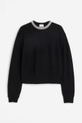 H&M Pullover mit Strassverzierung Schwarz in Größe XS. Farbe: Black