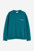 H&M Bedrucktes Sweatshirt in Loose Fit Blaugrün/Connected, Sweatshirts...