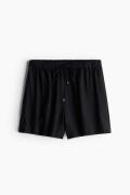 H&M Schlupfshorts Schwarz in Größe S. Farbe: Black